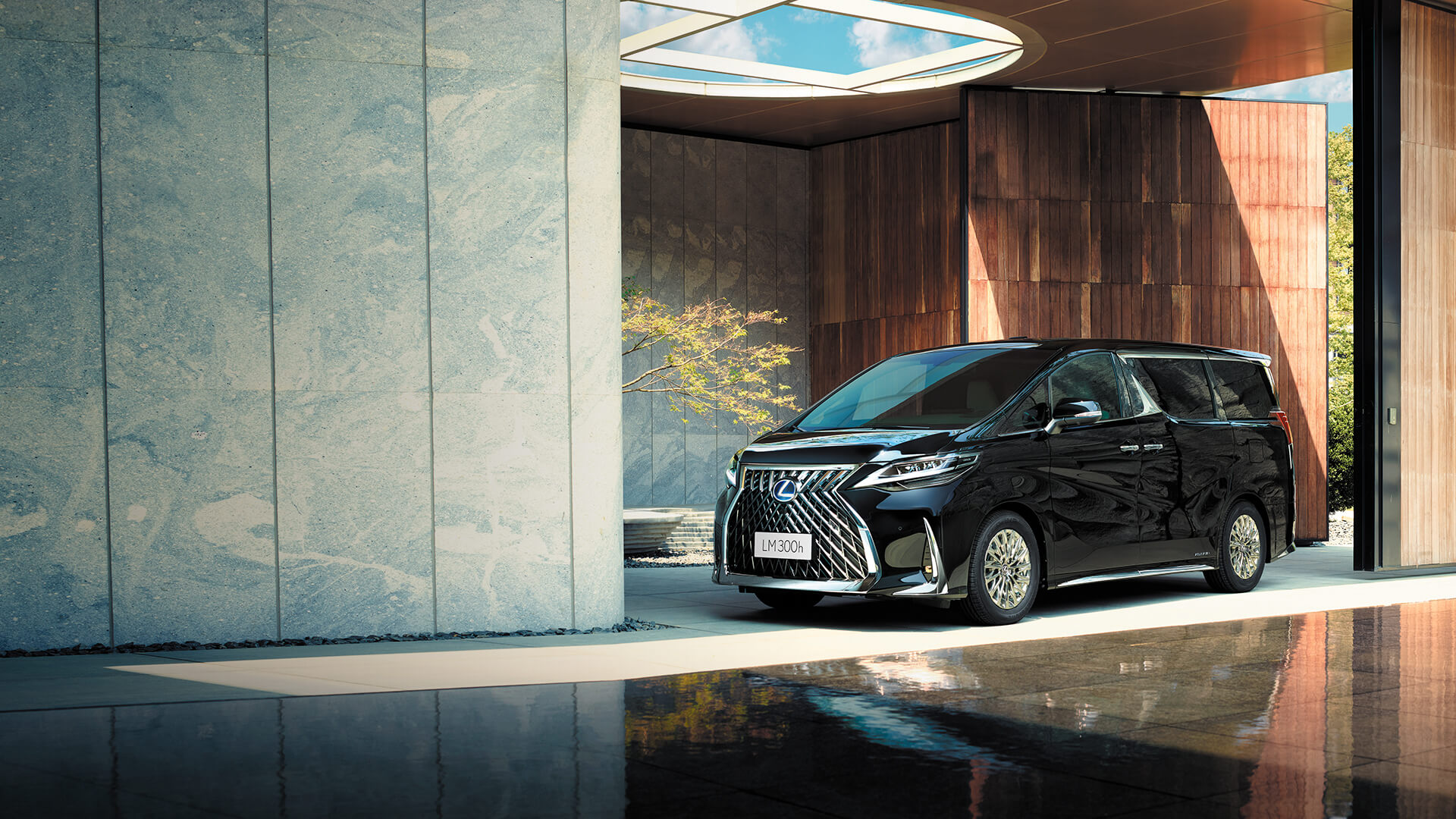 Black Lexus LM parked in a building.