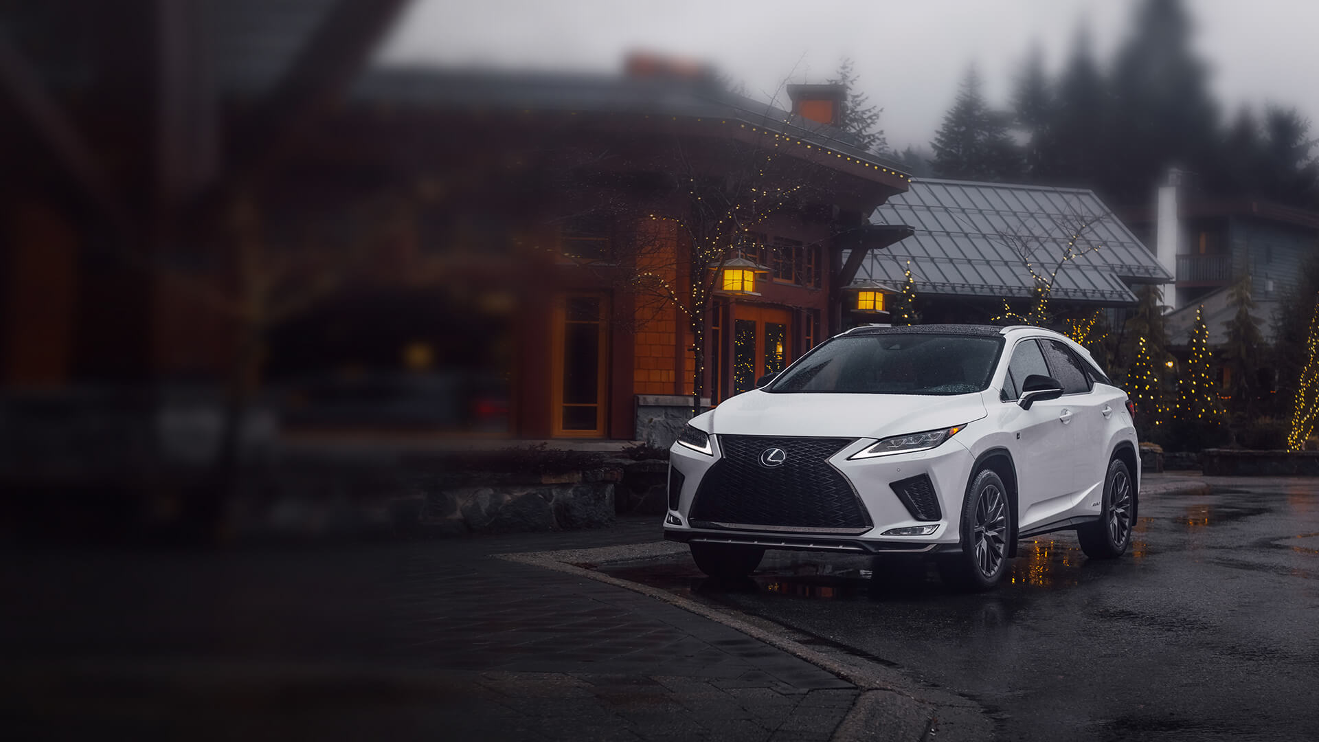 White Lexus RX parked in a town.